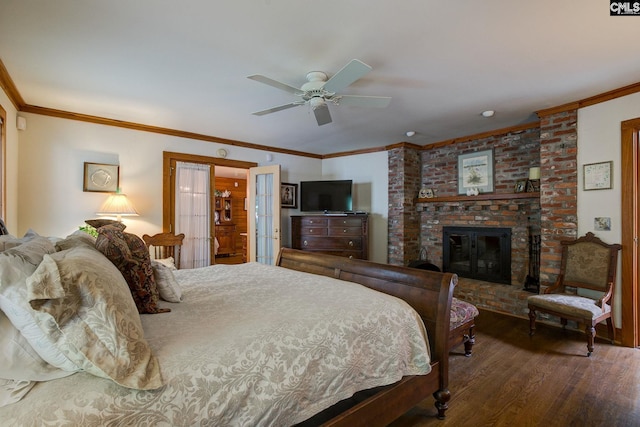 bedroom featuring wood-type flooring, ceiling fan, a fireplace, and crown molding