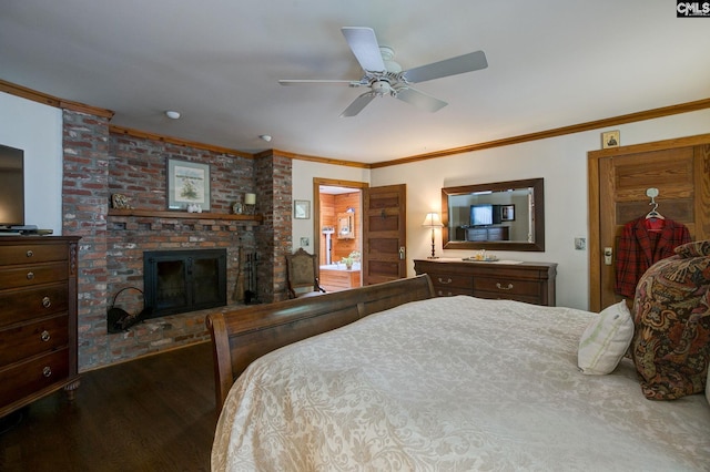 bedroom featuring wood-type flooring, ornamental molding, ceiling fan, and a brick fireplace