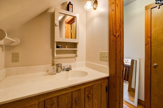 bathroom featuring vanity and hardwood / wood-style flooring