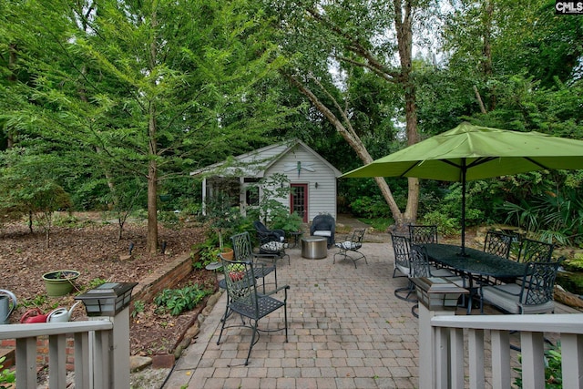 view of patio featuring an outbuilding