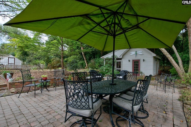 view of patio / terrace featuring an outbuilding