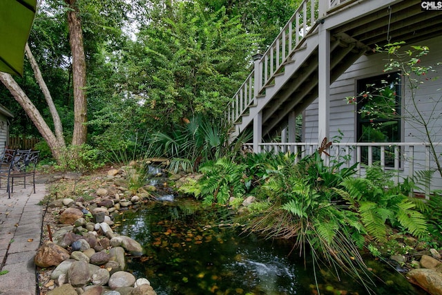 view of yard with a garden pond