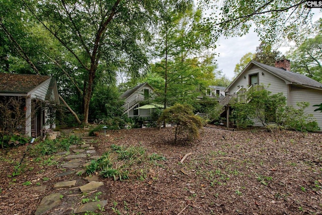 view of yard with a wooden deck