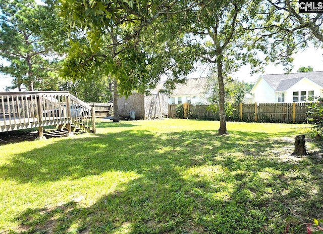 view of yard with a deck