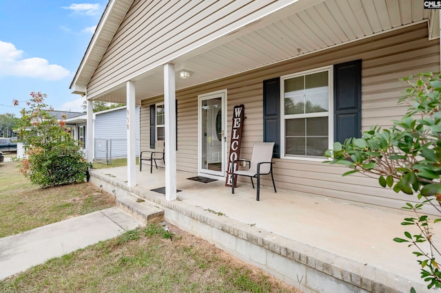 property entrance with covered porch