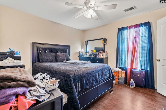 bedroom featuring ceiling fan and dark hardwood / wood-style flooring