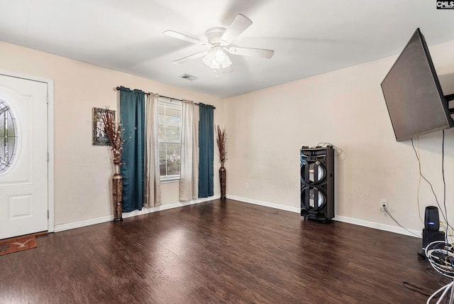 interior space featuring ceiling fan and dark hardwood / wood-style flooring