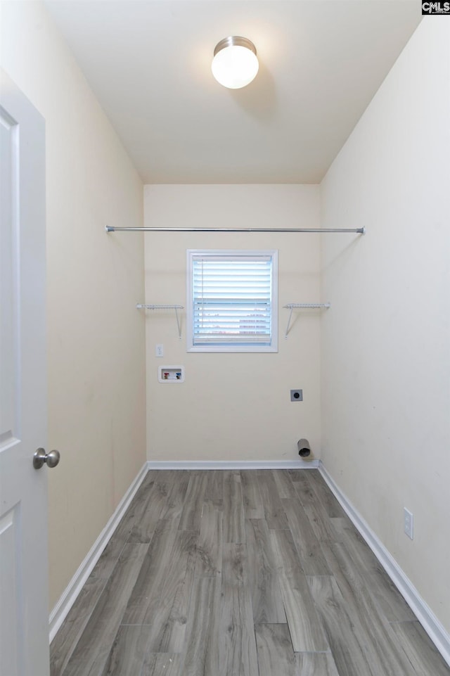 laundry room with light wood-type flooring, electric dryer hookup, and hookup for a washing machine