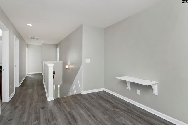 empty room featuring dark hardwood / wood-style flooring