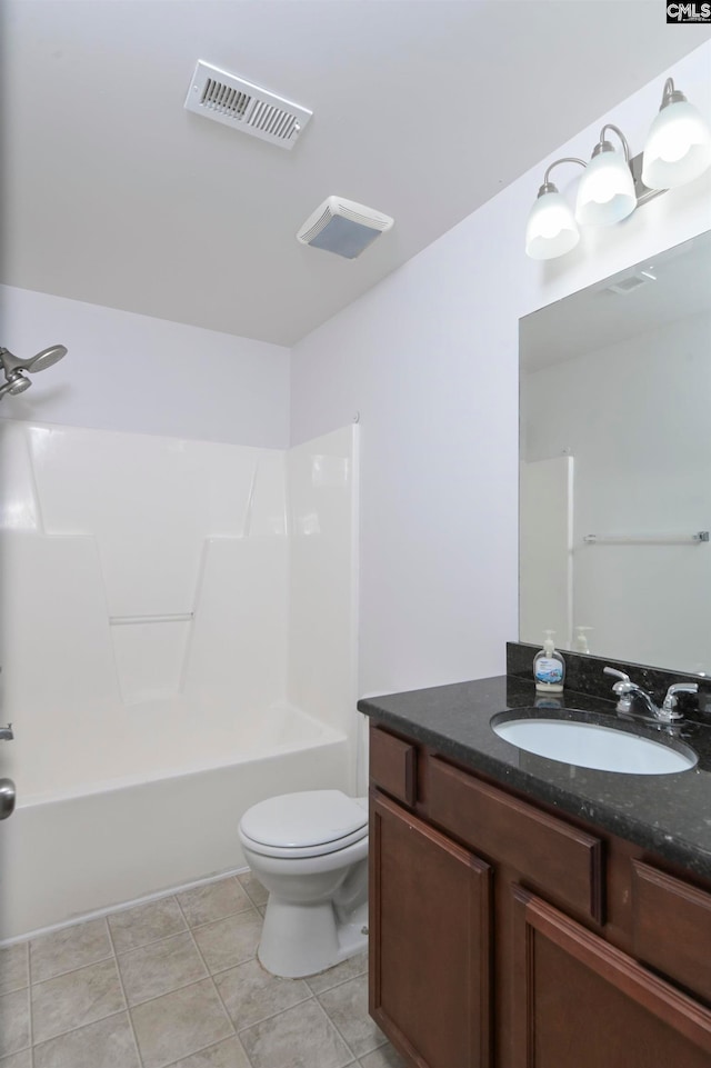 full bathroom featuring tile patterned floors, shower / bath combination, vanity, and toilet