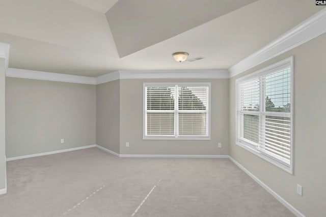 unfurnished room featuring light carpet and ornamental molding