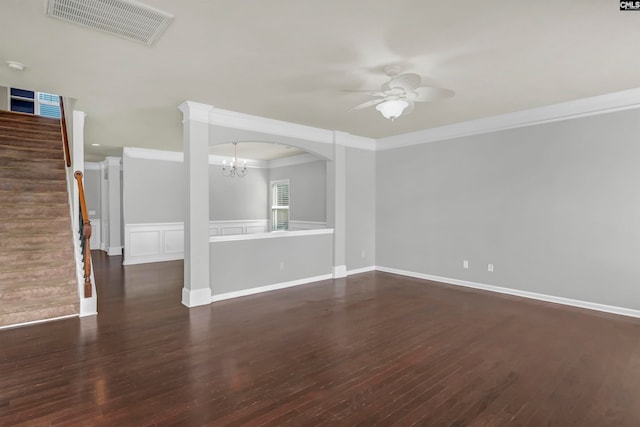 unfurnished living room featuring ceiling fan with notable chandelier, crown molding, and dark hardwood / wood-style flooring