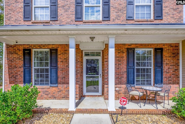 entrance to property featuring a porch