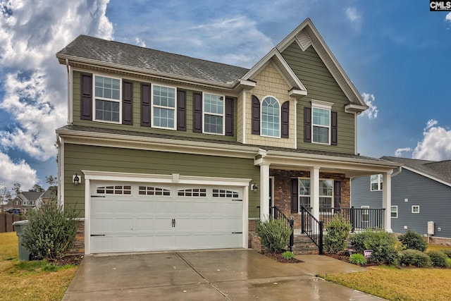 craftsman-style home with covered porch and a garage