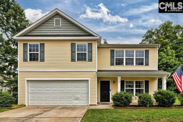 front facade with a garage and a front yard