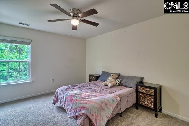 carpeted bedroom with ceiling fan