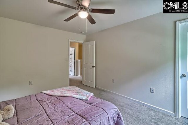 carpeted bedroom featuring ceiling fan