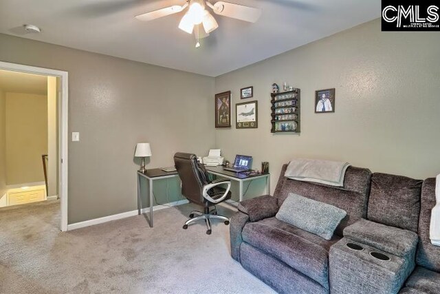 home office featuring ceiling fan and light carpet