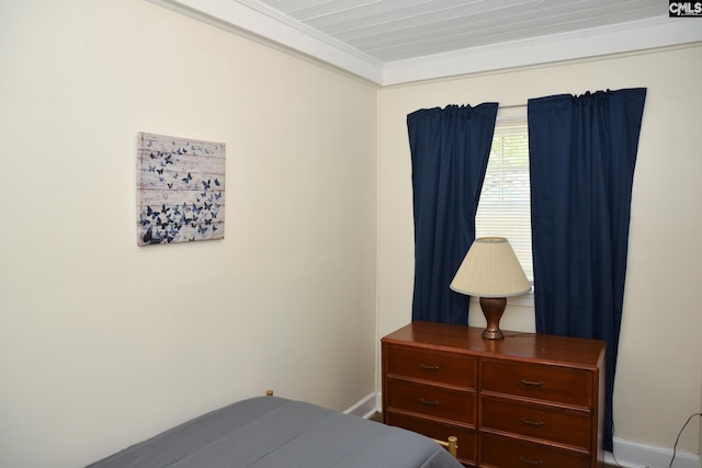 bedroom with ornamental molding