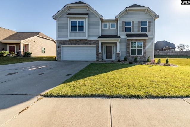 view of front of home featuring a front yard and a garage