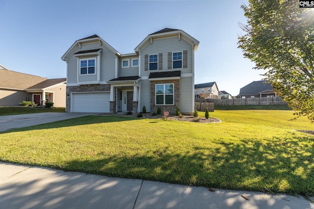 view of front facade featuring a front yard and a garage