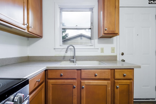 kitchen featuring sink and stainless steel electric range oven