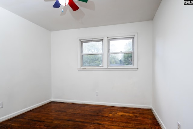 unfurnished room with ceiling fan and dark hardwood / wood-style flooring