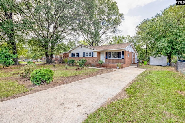 view of front of house with a front yard and covered porch