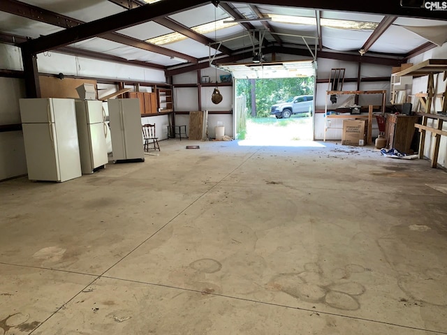 garage featuring white fridge