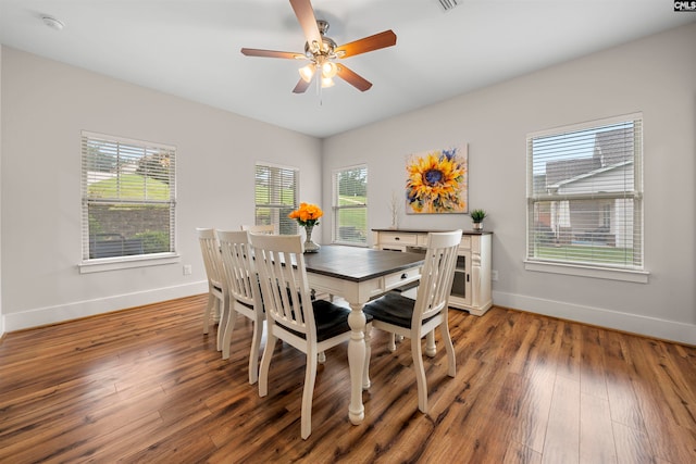 dining space with ceiling fan, hardwood / wood-style floors, and a healthy amount of sunlight