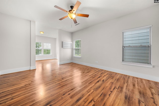 spare room with ceiling fan and wood-type flooring