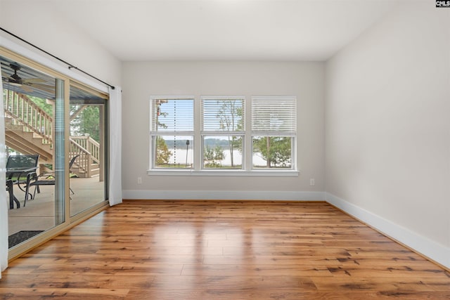 spare room with light wood-type flooring