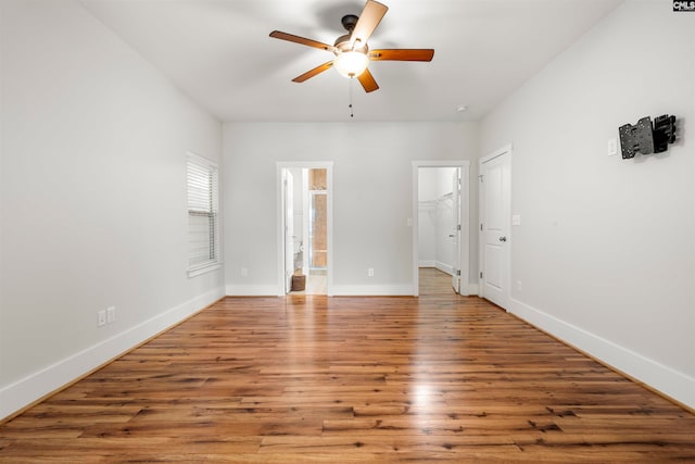 interior space with hardwood / wood-style floors and ceiling fan