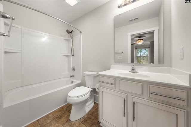 full bathroom with ceiling fan, vanity, tile patterned flooring, shower / bath combination, and toilet