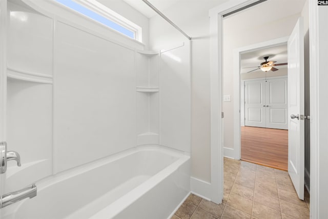 bathroom featuring ceiling fan, tile patterned flooring, and shower / washtub combination