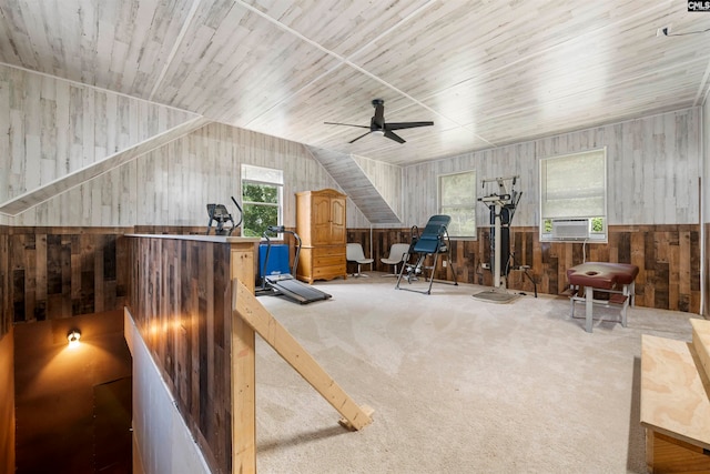 interior space with ceiling fan, lofted ceiling, plenty of natural light, and carpet