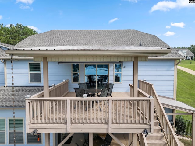 back of property featuring a wooden deck