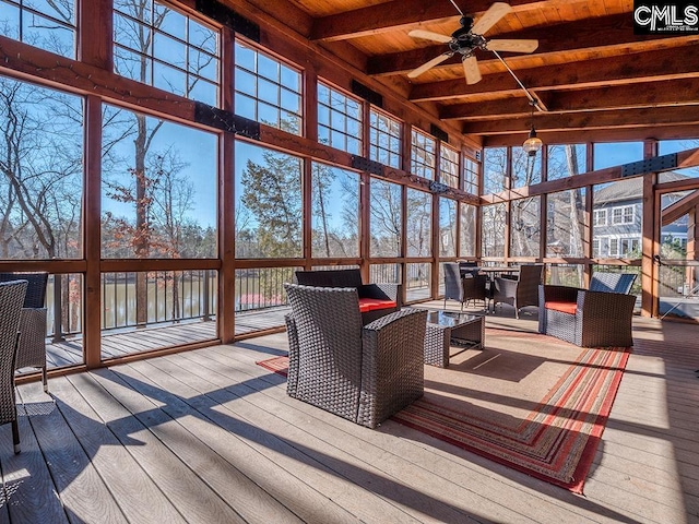 sunroom / solarium with ceiling fan, wooden ceiling, and vaulted ceiling with beams