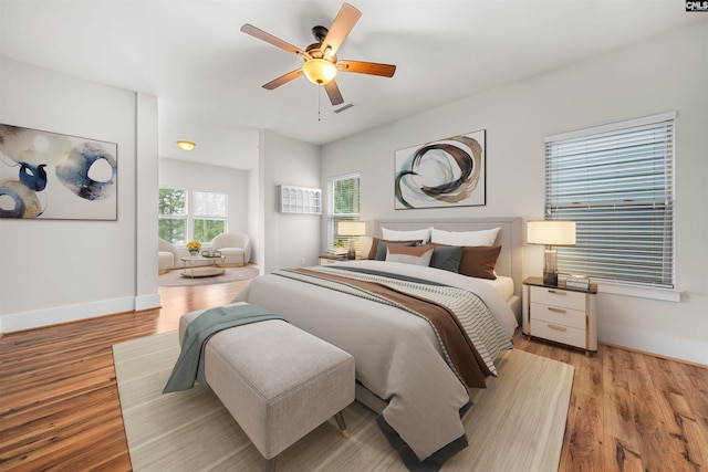 bedroom with light wood-type flooring and ceiling fan