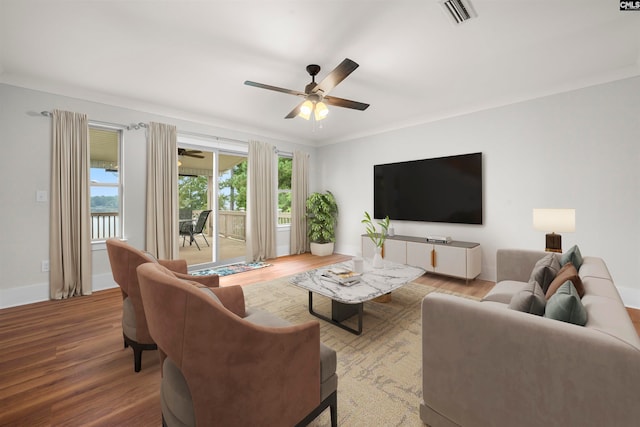 living room featuring ceiling fan, crown molding, and hardwood / wood-style floors