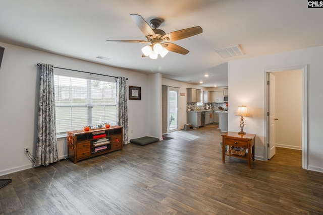 interior space featuring ceiling fan and dark hardwood / wood-style flooring