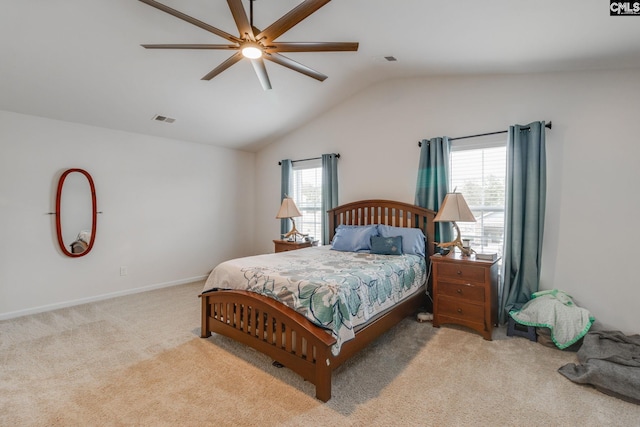 bedroom featuring light carpet, lofted ceiling, ceiling fan, and multiple windows