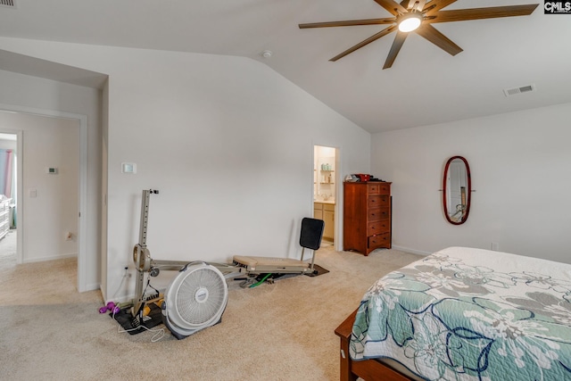 bedroom with ceiling fan, connected bathroom, lofted ceiling, and light carpet