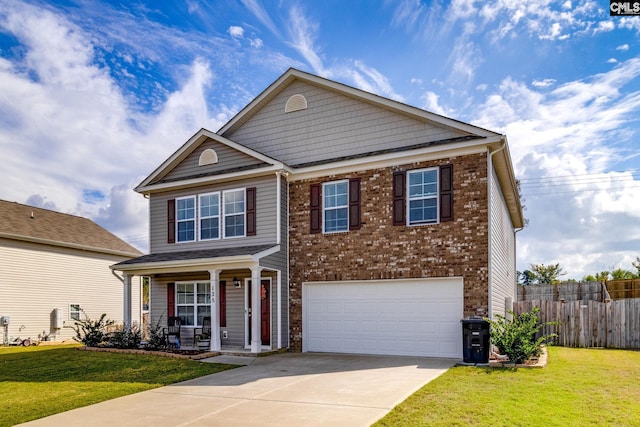 view of front of house featuring a garage and a front lawn