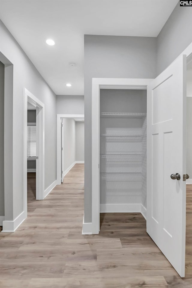 hallway featuring light hardwood / wood-style floors