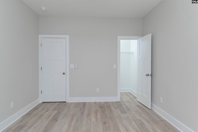 spare room with light wood-type flooring