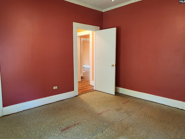 spare room featuring crown molding