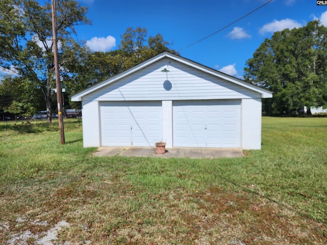 garage with a yard