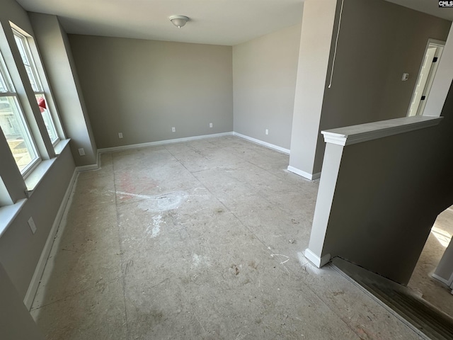 empty room featuring baseboards