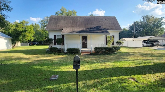 view of front of property featuring a carport and a front lawn